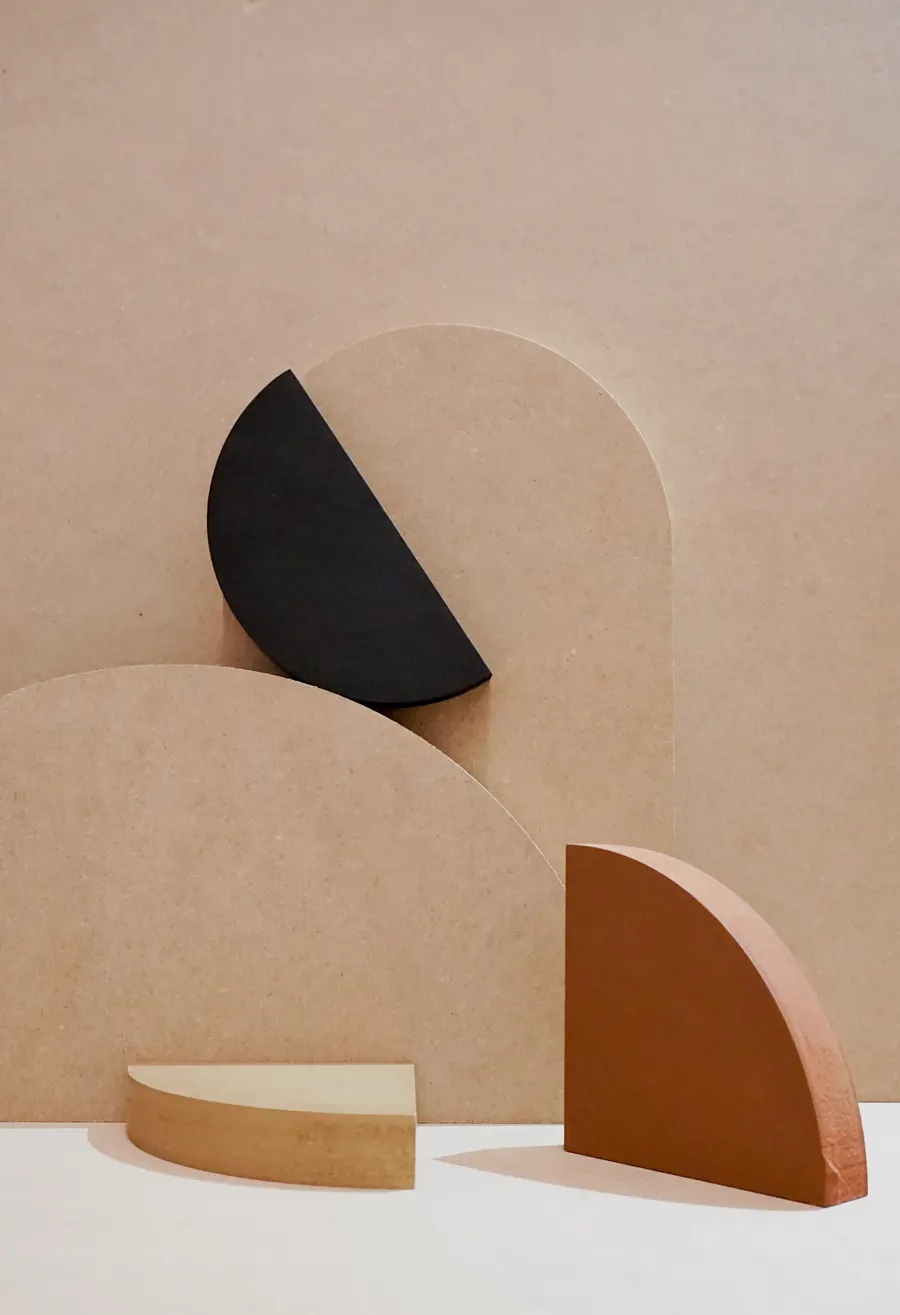 Geometric shapes arranged on a warm background